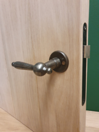 IJzer blank opengewerkte klink inclusief rozet