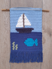 Patroon wandhanger In en op de zee