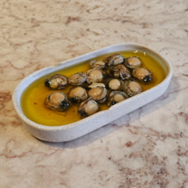 Kleine coquilles in pikante olijfolie