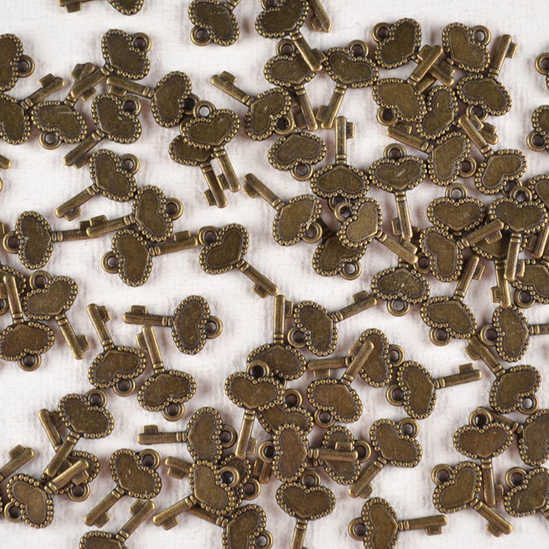 Bedel Sleuteltje – Mini Hartje in Bronskleur