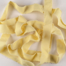 Gerafeld katoenen lint zachtgeel