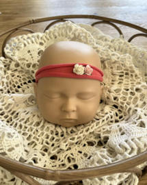 Newborn tieback koraal