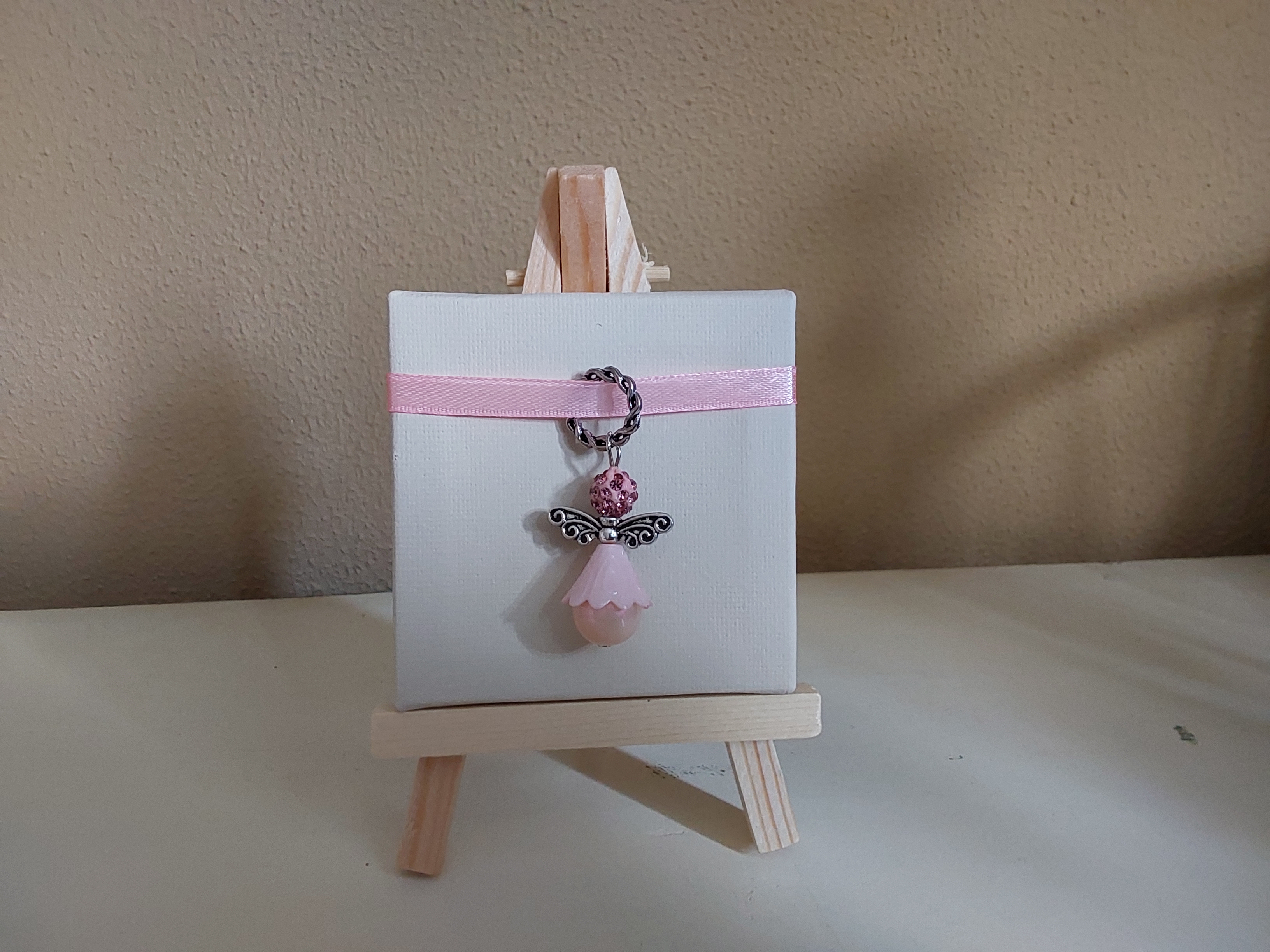 Bedeltje op canvasdoek