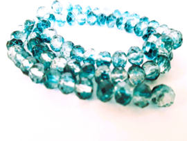 Facetkralen Kristal blauwgroen 6x8mm, per streng van 70 kralen