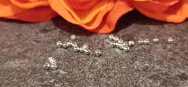 Knijpkralen zilver nikkelvrij 2.5 mm, ongeveer 80 stuks