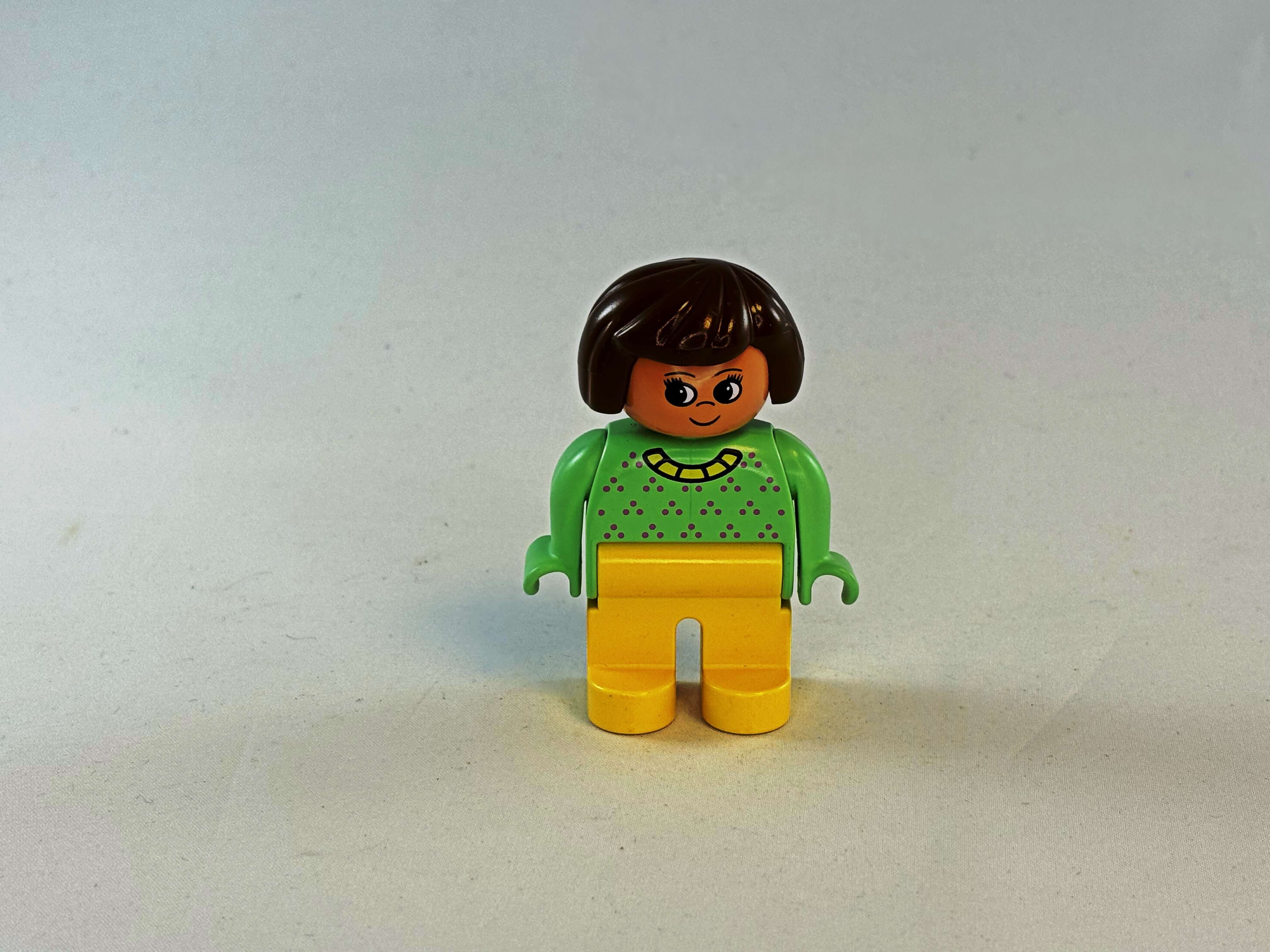 Vrouw groen geel Duplo