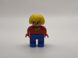 Vrouw geel haar rode trui Duplo