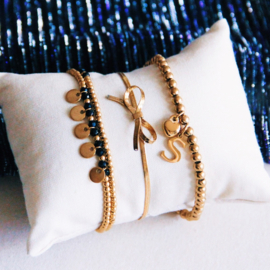 Platte slangenarmband met strikje