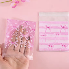 Inpakzakje plastic Roze strikjes , 10 stuks