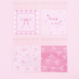 Inpakzakje plastic Roze strikjes , 10 stuks