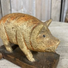 Wooden pig on wheels
