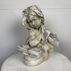 Concrete statue girl with book