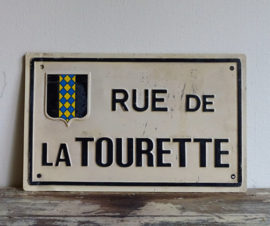 Street sign "Rue de la Tourette"