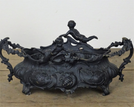 Iron jardinière with angels
