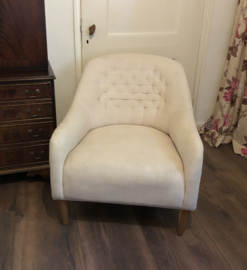 Fauteuil capiton rug