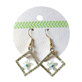 Glitter oorbellen met bloem (zilverkleurig)