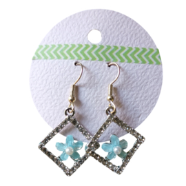 Glitter oorbellen met bloem (zilverkleurig)