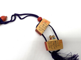 Japanse inro met kokeshi