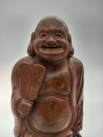 Lachende boeddha op basement