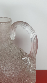 Glazen flesje met reliëfstructuur