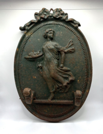 Groene, gietijzeren muurplaquette