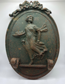 Groene, gietijzeren muurplaquette