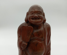 Lachende boeddha op basement
