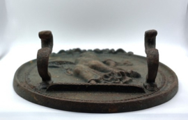 Groene, gietijzeren muurplaquette