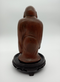 Lachende boeddha op basement