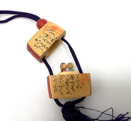 Japanse inro met kokeshi