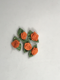 losse bloemtjes groot   oranje  met  groen blaadje € 1,95