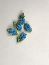 losse bloemtjes groot turquois   met groen blaadje € 1,95