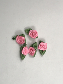 losse bloemtjes groot   fluor roze  met  groen blaadje € 1,95
