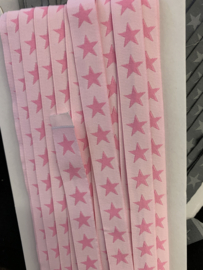 Licht roze met fuchsia  sterren   € 1,95 per  meter