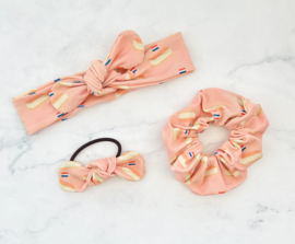 Knoophaarband Oranjetompouce