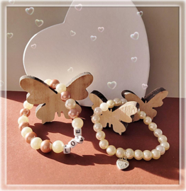 gebroken witte acryl parel armband 17 cm