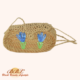 Braided handbag with flower decoration