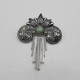 Broche met turquoise steentje