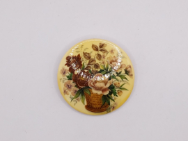 Ronde broche met bloemdecor