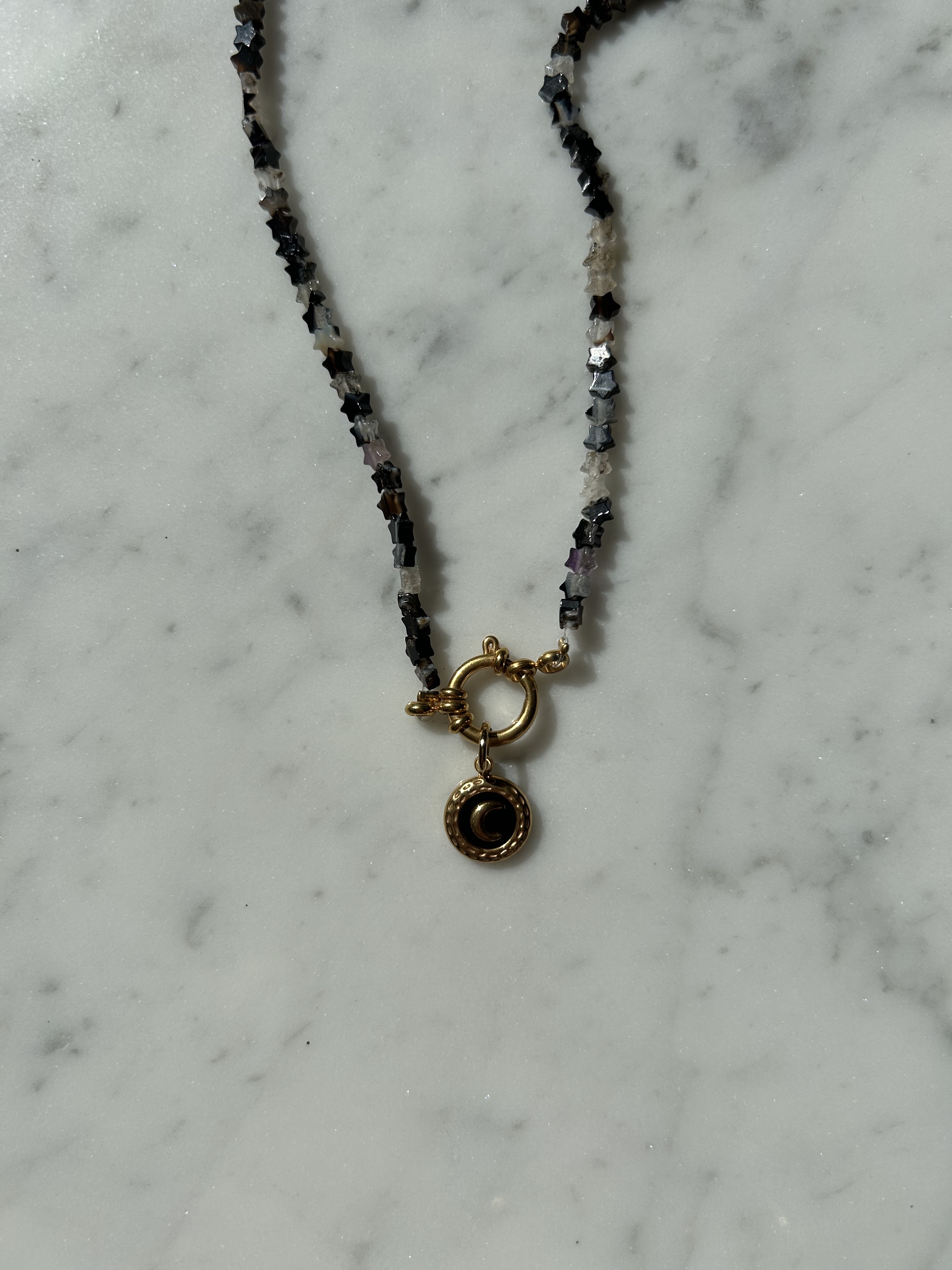Golden black stars with moon coin