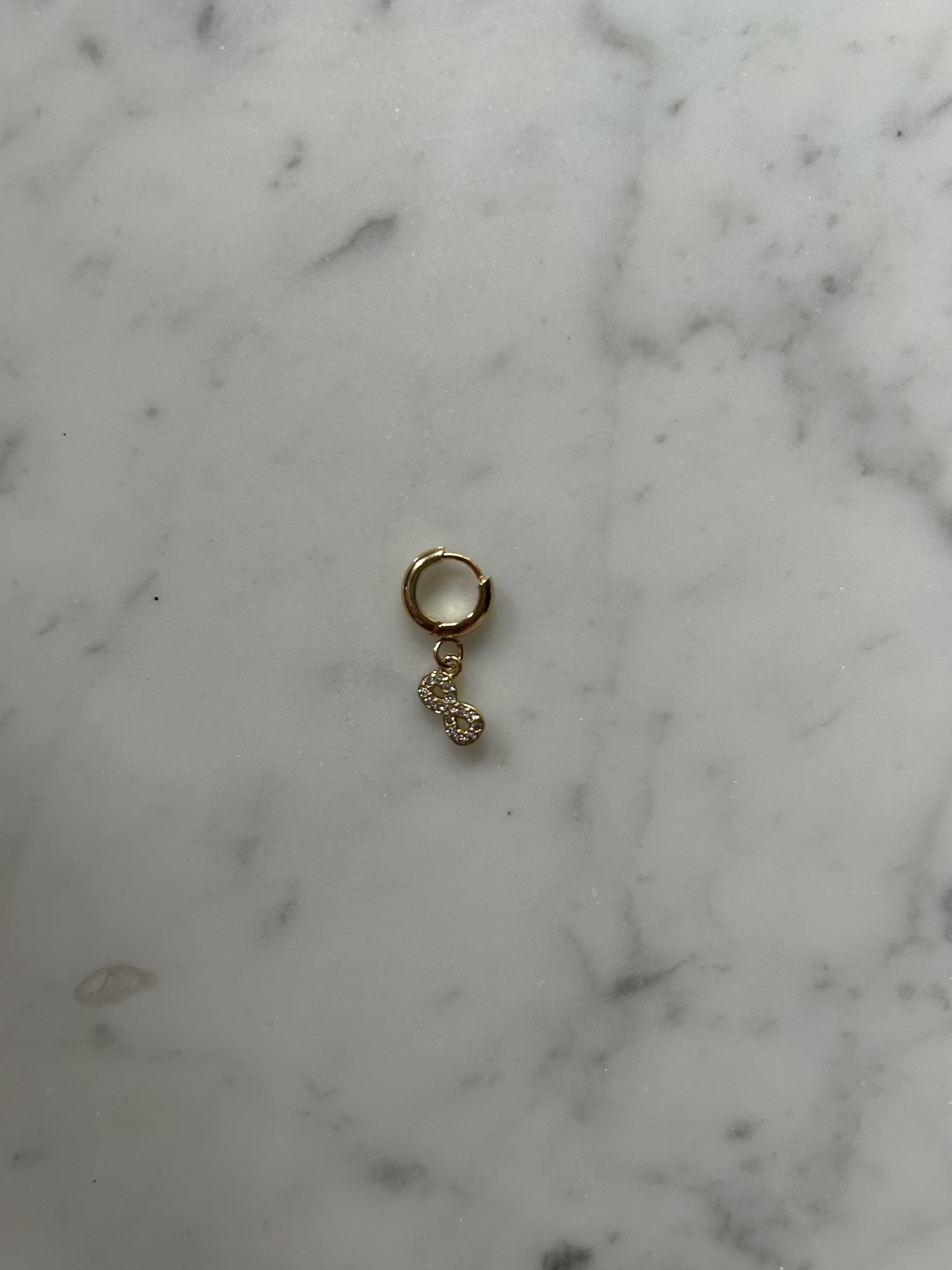 Golden infinity sign
