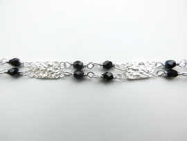 Zilveren piet-piet zwarte kralen bracelet.