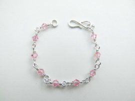 Zilveren roze kralen baby bracelet.