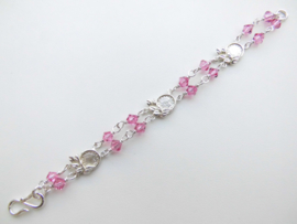 Zilveren muntjes-roze kralen baby bracelet.