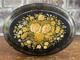 ovaal zwart blik gele bloemen