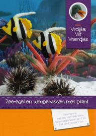 Zee-egel en wimpelvissen met plant