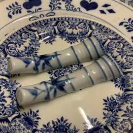 Set van 8 porseleinen messenleggers