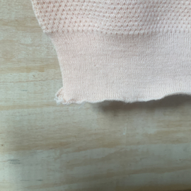 Een roze oud , nieuw onderhemdje.