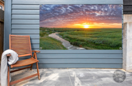 De Slufter tijdens zonsondergang, ringen in de hoeken.