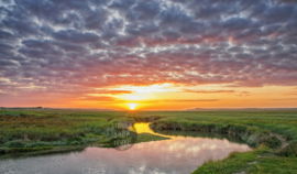 De Slufter tijdens zonsondergang, ringen in de hoeken.